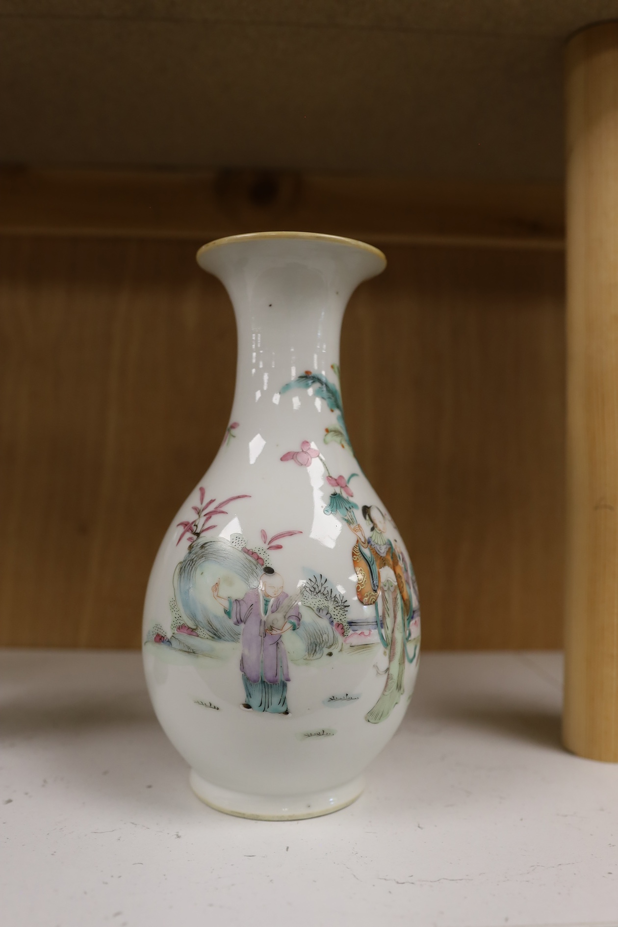 A Chinese porcelain famille rose vase, Qianlong red seal mark to the base, but early 20th century, 22cm high. Condition - good